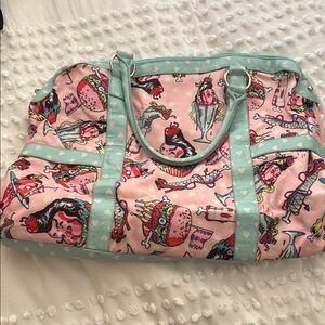 Iron Fist Pink and Blue Travel Bags with Whimsical Design